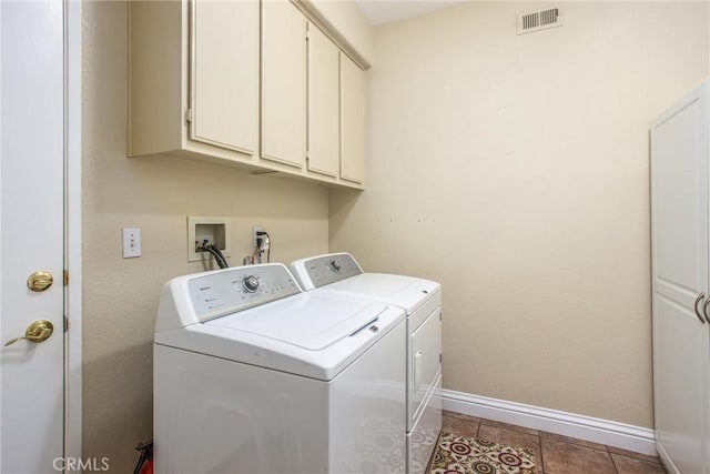 684 Big Spring Dr, Banning, CA 92220 - laundry room with washing machine and dryer, cabinet space, baseboards, and light tile patterned floors