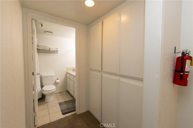 41764 Brownie Ln Unit 5, Big Bear Lake, CA 92315 - bathroom featuring toilet, tile patterned floors, and vanity