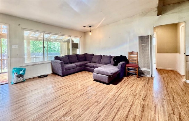 3260 E Westfall Rd, Mariposa, CA 95338 - living room featuring a heating unit, wood finished floors, and wainscoting