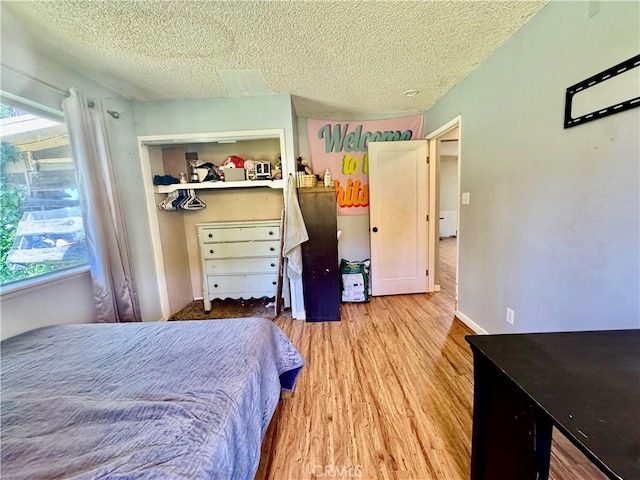 3260 E Westfall Rd, Mariposa, CA 95338 - bedroom with wood finished floors and a textured ceiling