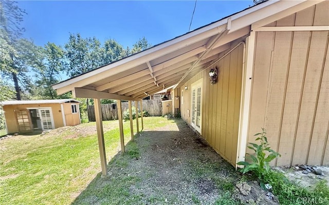 3260 E Westfall Rd, Mariposa, CA 95338 - view of yard featuring an outdoor structure, a carport, and french doors
