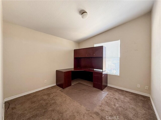 74804 Amboy Rd Unit 29, Palms, CA 92277 - unfurnished office with carpet flooring, lofted ceiling, and baseboards