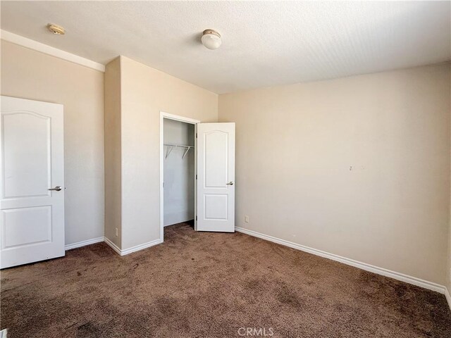 74804 Amboy Rd Unit 29, Palms, CA 92277 - unfurnished bedroom with carpet, baseboards, and a closet