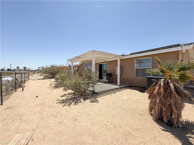 74804 Amboy Rd Unit 29, Palms, CA 92277 - back of property with a pergola and stucco siding