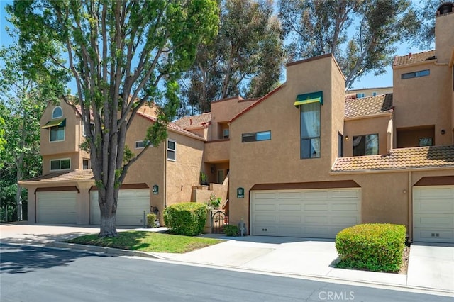 3040 La Paz Ln Unit B, Diamond Bar, CA 91765 - view of property with stucco siding, a garage, a tile roof, and concrete driveway