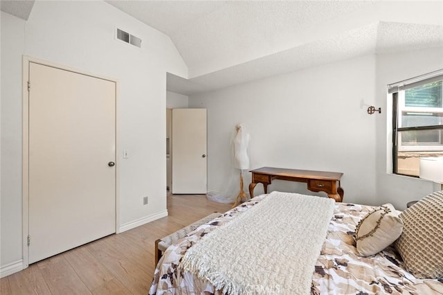 3040 La Paz Ln Unit B, Diamond Bar, CA 91765 - bedroom with lofted ceiling, light wood-style flooring, a textured ceiling, and baseboards
