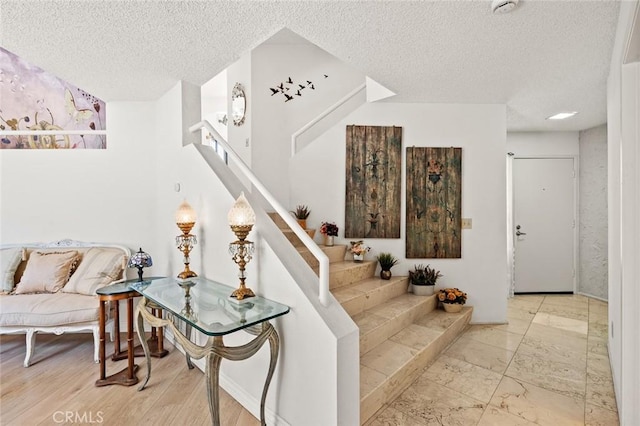 3040 La Paz Ln Unit B, Diamond Bar, CA 91765 - stairway with a textured ceiling