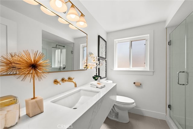 bathroom featuring a shower stall, tile patterned flooring, toilet, and baseboards