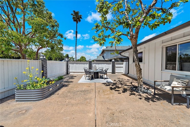 fenced backyard featuring a patio area and outdoor dining space