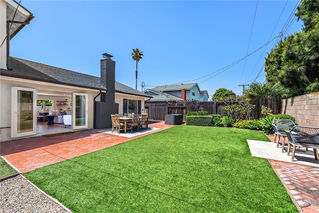 view of yard with a patio and central AC