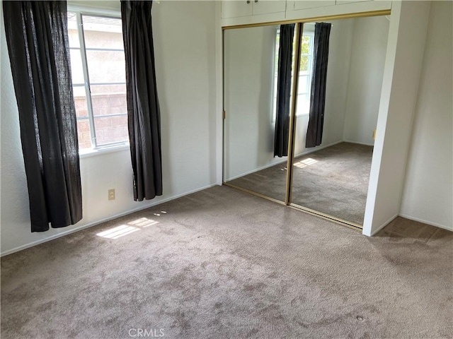 17628 Kornblum Ave, Torrance, CA 90504 - unfurnished bedroom featuring carpet flooring, a closet, and multiple windows