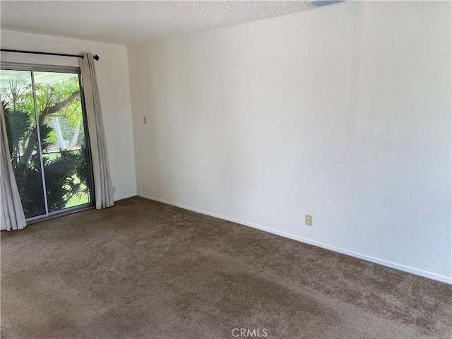 17628 Kornblum Ave, Torrance, CA 90504 - carpeted empty room with baseboards and a textured ceiling