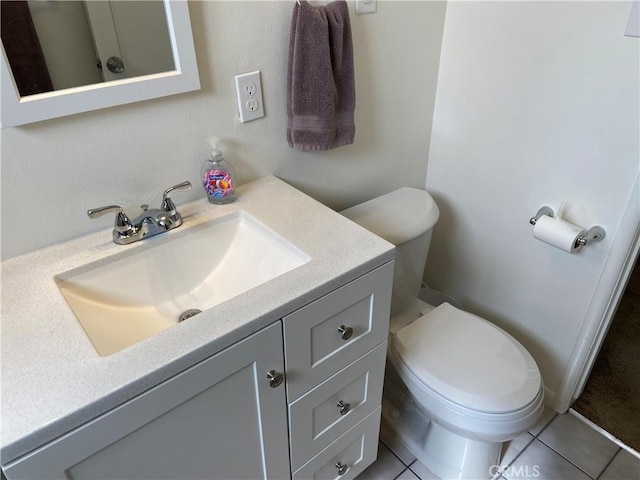 17628 Kornblum Ave, Torrance, CA 90504 - half bathroom with vanity, toilet, and tile patterned floors