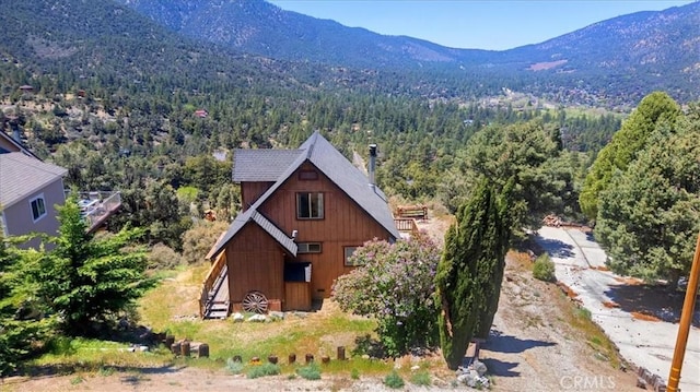 15440 Shasta Way, Pine Mountain Club, CA 93225 - view of front of home with a view of trees and a mountain view