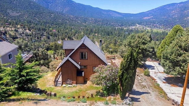 15440 Shasta Way, Pine Mountain Club, CA 93225 - view of subject property with a heavily wooded area and a mountain backdrop