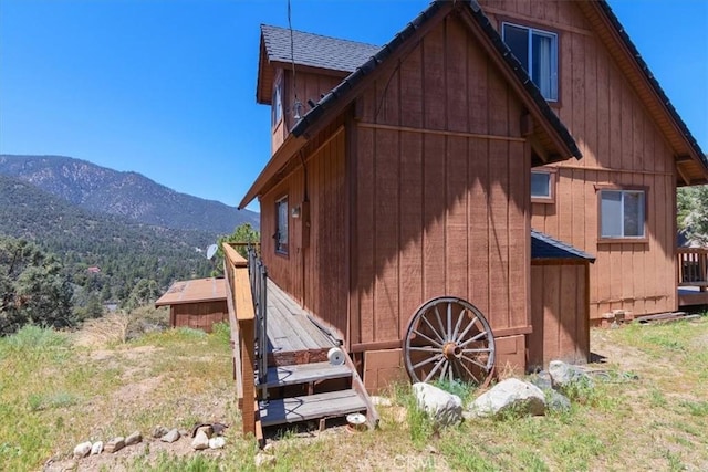 15440 Shasta Way, Pine Mountain Club, CA 93225 - view of home's exterior with a mountain view and a shingled roof