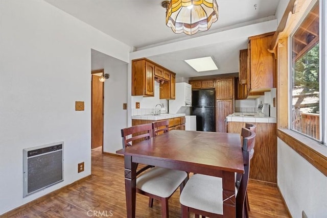 15440 Shasta Way, Pine Mountain Club, CA 93225 - dining space featuring heating unit and dark wood finished floors