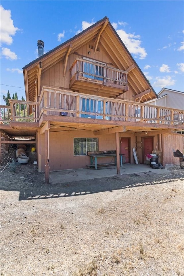 15440 Shasta Way, Pine Mountain Club, CA 93225 - back of property with board and batten siding and a deck