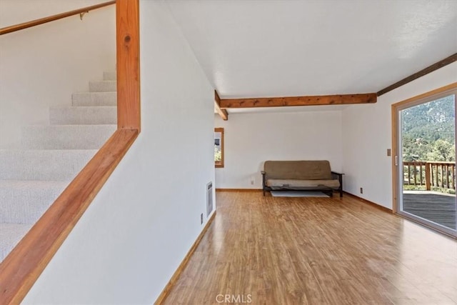 15440 Shasta Way, Pine Mountain Club, CA 93225 - sitting room featuring wood finished floors, beam ceiling, and stairs