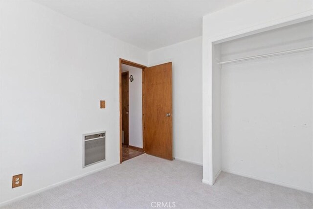 15440 Shasta Way, Pine Mountain Club, CA 93225 - unfurnished bedroom with heating unit, light carpet, and a closet