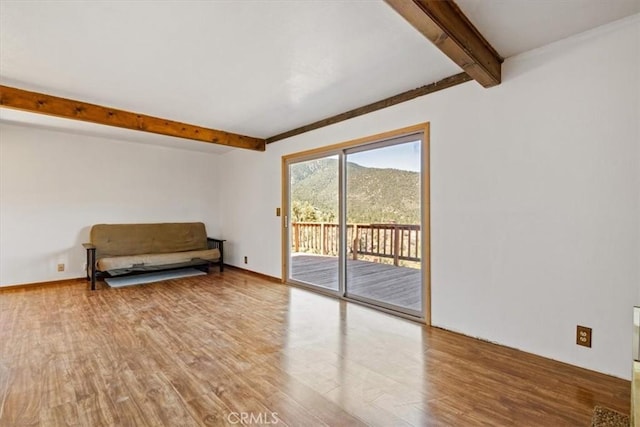 15440 Shasta Way, Pine Mountain Club, CA 93225 - sitting room featuring beam ceiling and wood finished floors