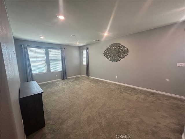 16654 Emerson Ln, Fontana, CA 92336 - spare room featuring dark colored carpet and recessed lighting