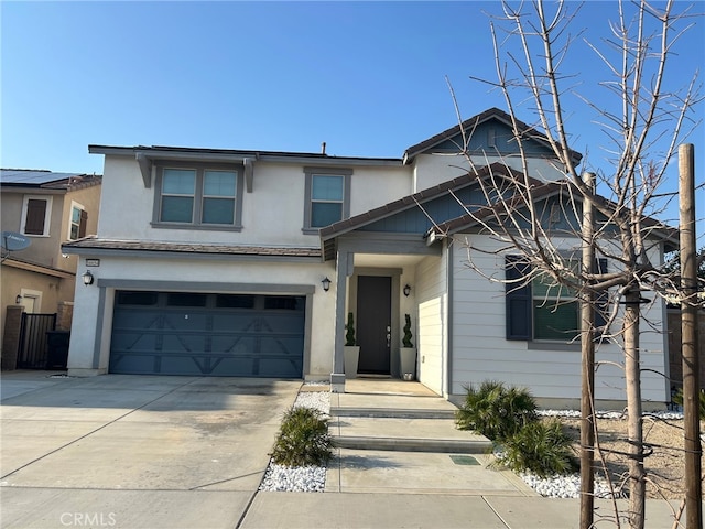 16654 Emerson Ln, Fontana, CA 92336 - view of front facade featuring concrete driveway, a garage, and stucco siding