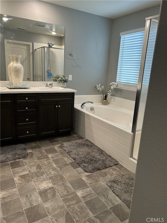 16654 Emerson Ln, Fontana, CA 92336 - full bath featuring vanity, a bath, and a shower stall