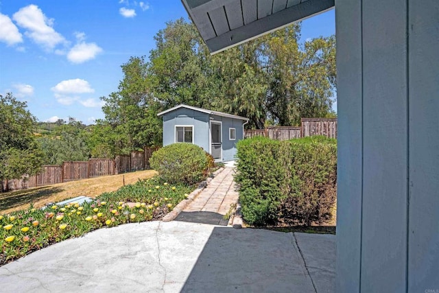 5221 Olive Hill Rd, Fallbrook, CA 92028 - view of patio featuring an outdoor structure and fence