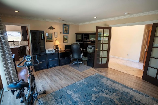 5221 Olive Hill Rd, Fallbrook, CA 92028 - home office featuring french doors, light wood finished floors, ornamental molding, a sink, and baseboards