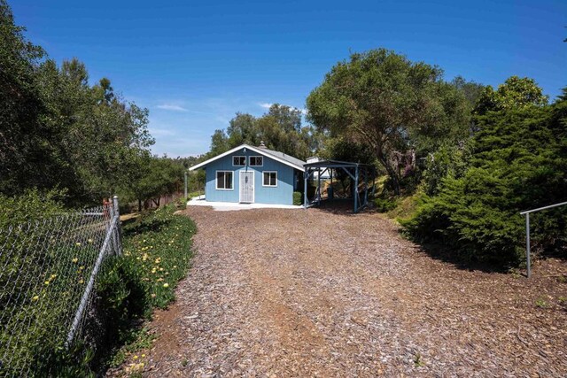 5221 Olive Hill Rd, Fallbrook, CA 92028 - view of front of home featuring dirt driveway and fence