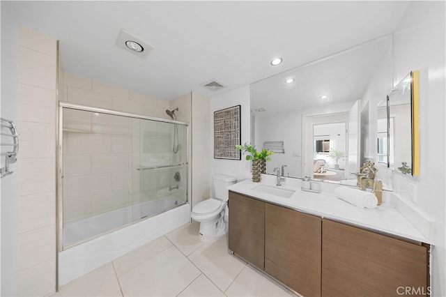 bathroom with toilet, vanity, shower / bath combination with glass door, tile patterned floors, and recessed lighting