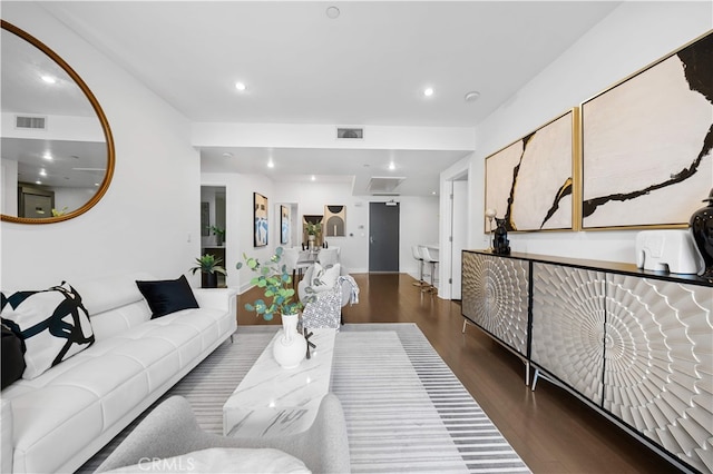 living room featuring wood finished floors and recessed lighting