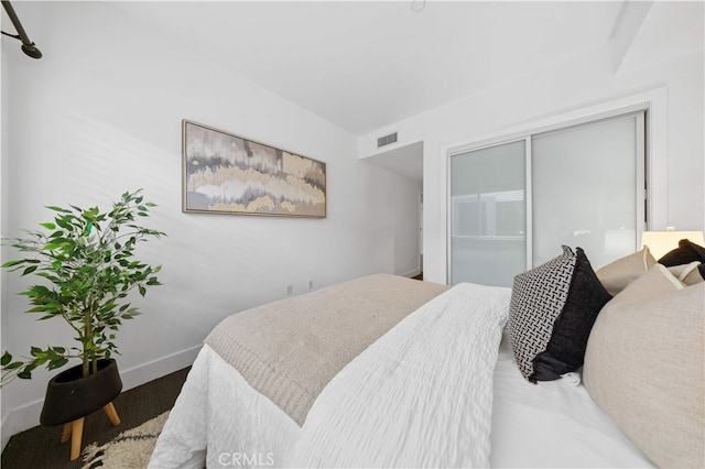 bedroom featuring a closet and baseboards