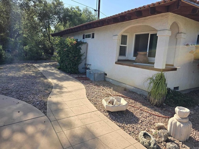 30603 Roadrunner Rdg, Valley Center, CA 92082 - view of side of home with crawl space and stucco siding