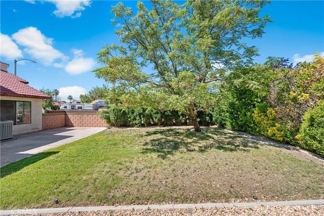 view of yard featuring a patio area and central air condition unit