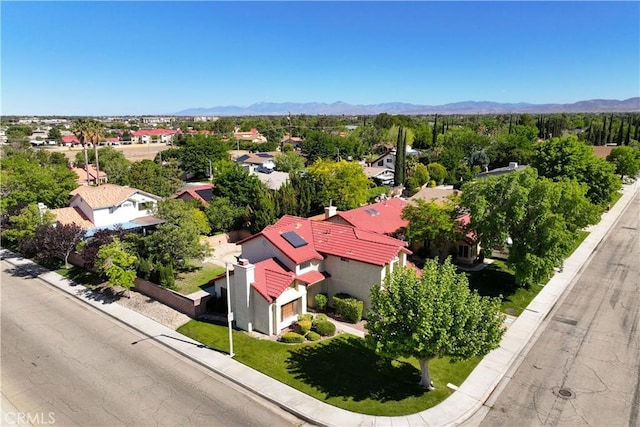 aerial perspective of suburban area featuring a mountainous background