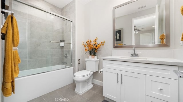 8798 Justify Dr, Rancho Cucamonga, CA 91701 - bathroom with tile patterned flooring, vanity, toilet, ceiling fan, and combined bath / shower with glass door
