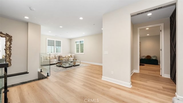 8798 Justify Dr, Rancho Cucamonga, CA 91701 - sitting room with light wood finished floors, recessed lighting, and baseboards