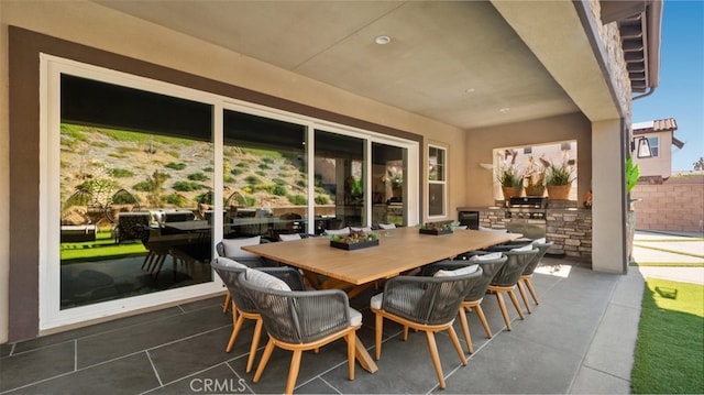 8798 Justify Dr, Rancho Cucamonga, CA 91701 - view of patio featuring outdoor dining space and exterior kitchen