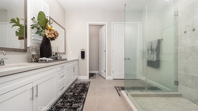 8798 Justify Dr, Rancho Cucamonga, CA 91701 - full bathroom featuring a stall shower, tile patterned flooring, double vanity, and baseboards