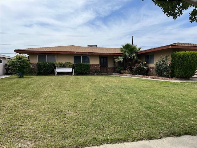 9846 Tamarind Ave, Bloomington, CA 92316 - ranch-style house with stucco siding, a front lawn, and brick siding