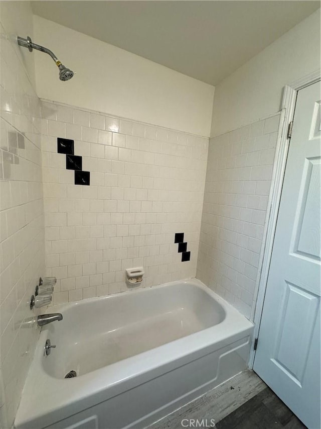 bathroom with wood finished floors and shower / bath combination