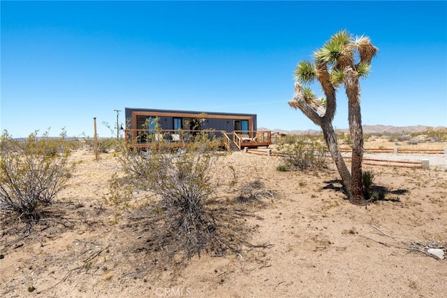 1375 Fortuna Ave, Landers, CA 92285 - view of front of home featuring a deck and a view of rural / pastoral area