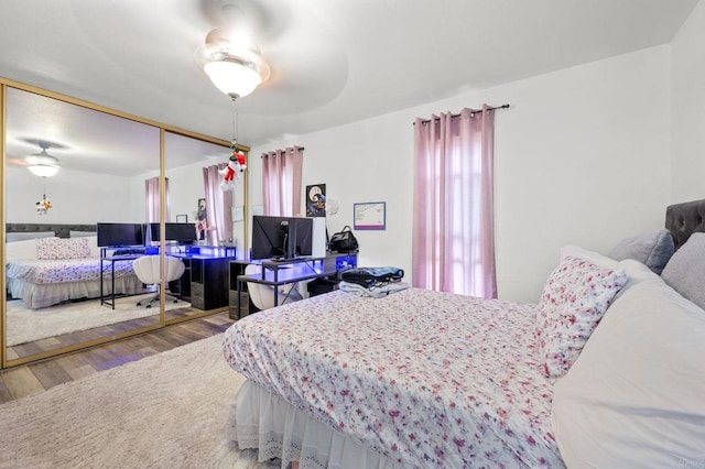 3470 Peach Tree Way, Oceanside, CA 92058 - bedroom with wood finished floors, a closet, a desk, and a ceiling fan