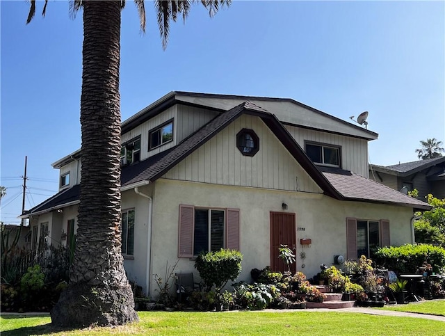 239255 N Sierra Bonita Ave, Pasadena, CA 91106 - view of front of house featuring stucco siding, a front lawn, and roof with shingles
