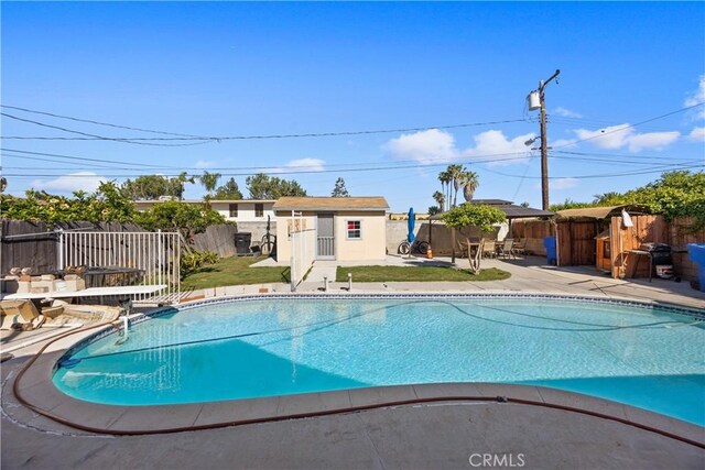 1118 Kwis Ave, Hacienda Heights, CA 91745 - view of swimming pool with a patio and an outbuilding