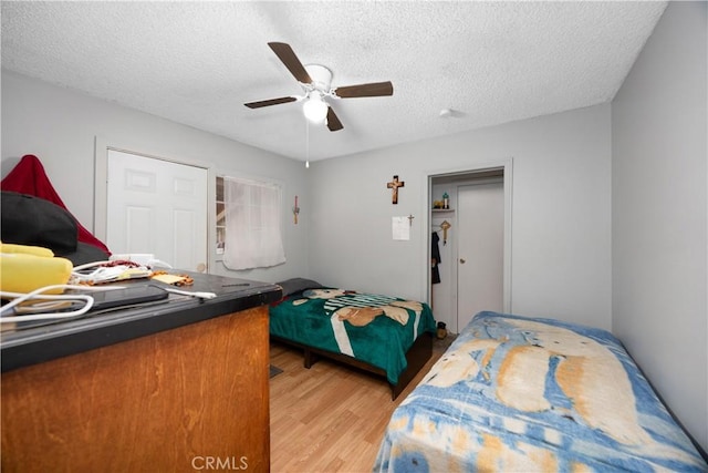 1118 Kwis Ave, Hacienda Heights, CA 91745 - bedroom with light wood-type flooring, a textured ceiling, and ceiling fan