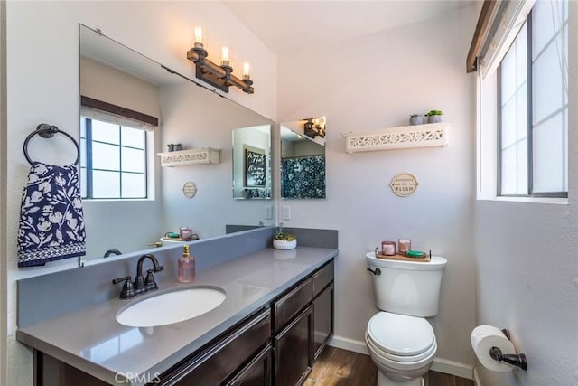 33693 Cattle Creek Rd, Acton, CA 93510 - bathroom featuring toilet, vanity, wood finished floors, and baseboards