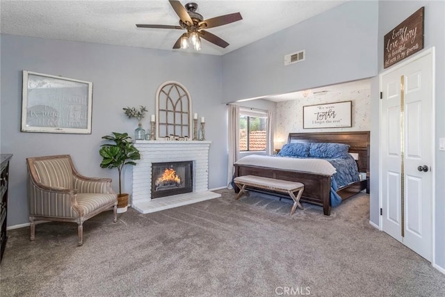 33693 Cattle Creek Rd, Acton, CA 93510 - bedroom featuring carpet flooring, a brick fireplace, vaulted ceiling, and ceiling fan